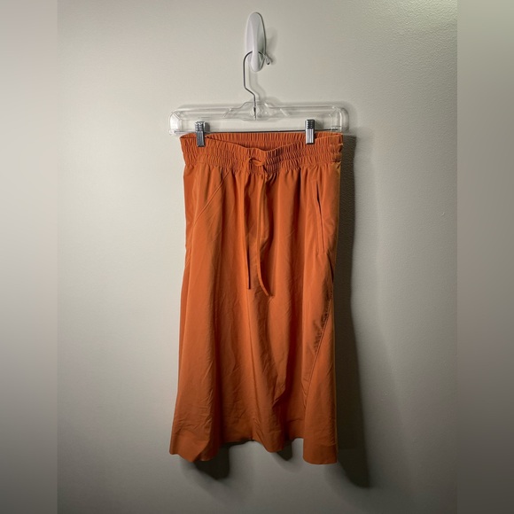 Athleta Dresses & Skirts - Athleta Orange Arrival Midi Skirt Hiking Camping UPF 50+ Relaxed Fit Pockets